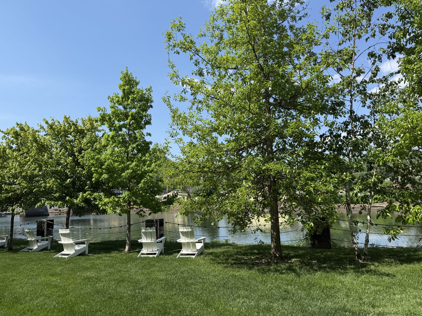 Adirondack chairs at the creekside
